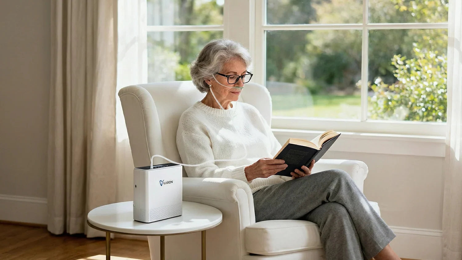 VARON portable oxygen concentrator with carrying bag beside a woman relaxing in a bright living room
